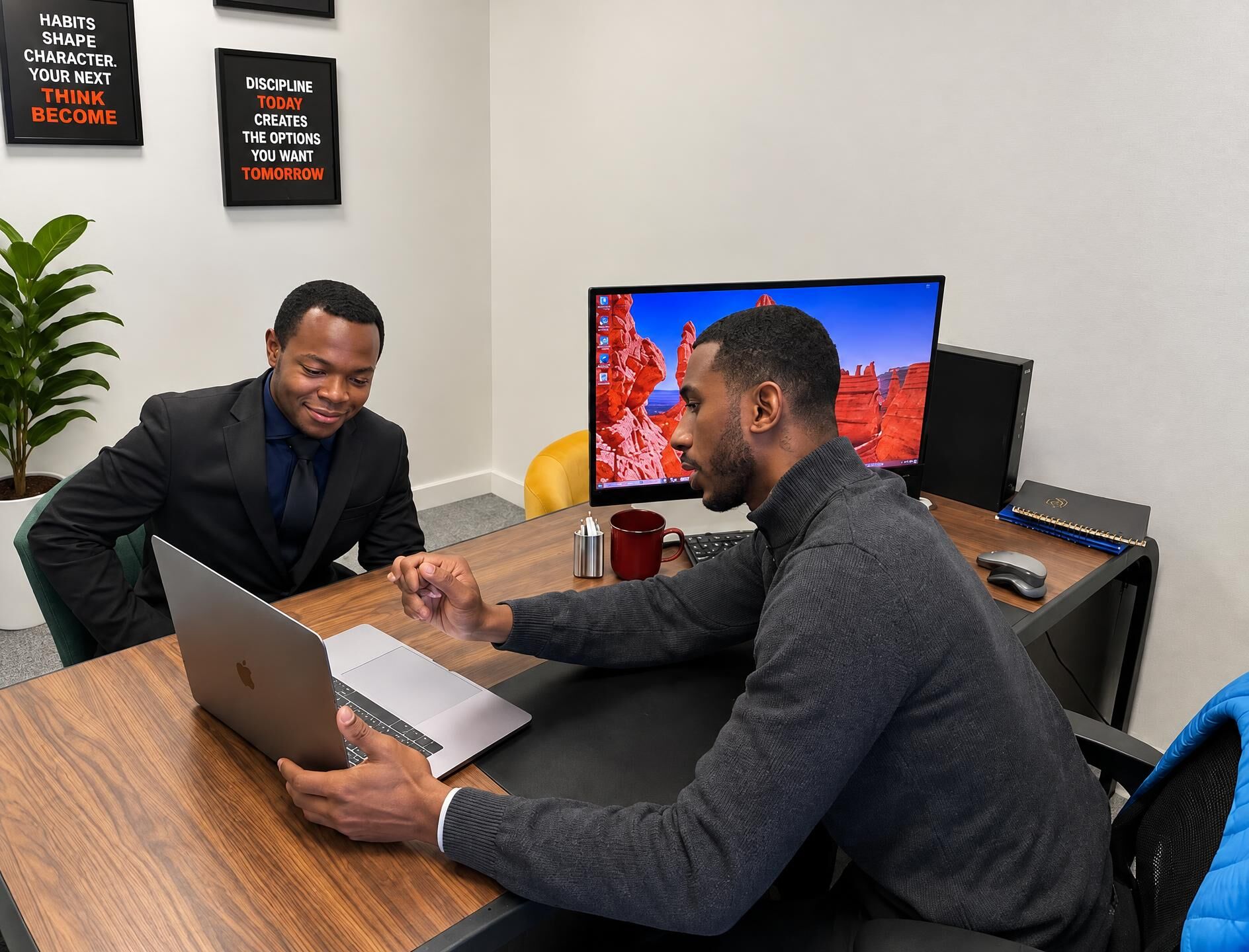 ScorpCo colleagues discussing work together in the office
